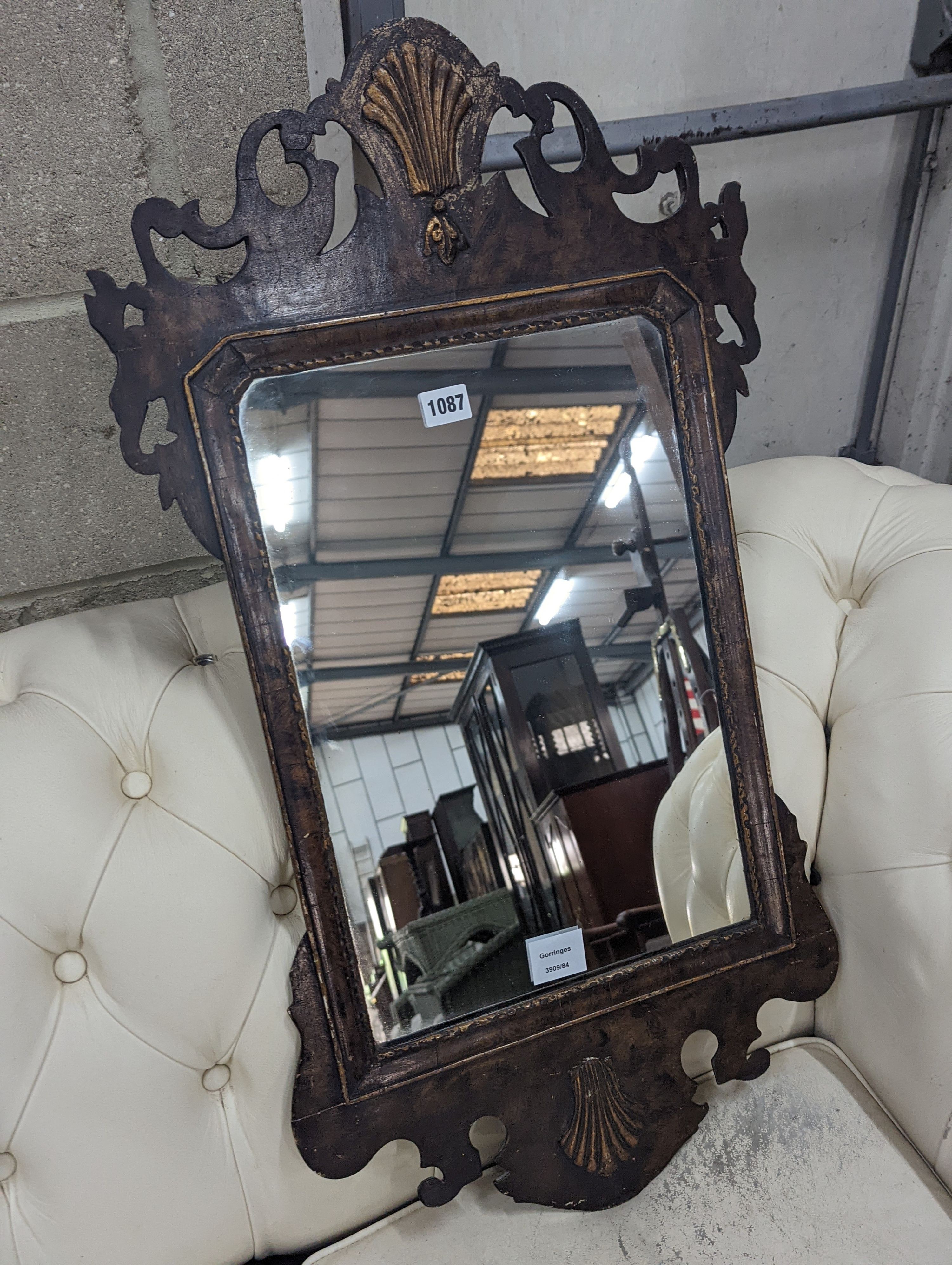 A George II style parcel gilt fret cut wall mirror, width 44cm, height 81cm